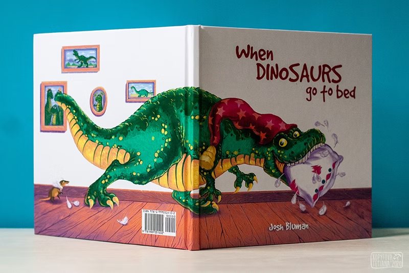Front and back cover of the book laid open, showing the full wraparound illustration